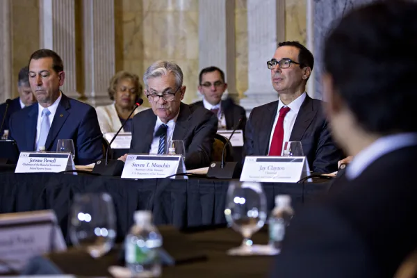 Joseph Otting, Jerome Powell, and Steven Mnuchin at the Financial Stability Oversight Council meeting. (Andrew Harrer/Bloomberg)