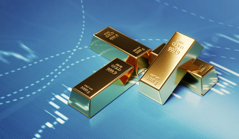 Gold Bars Sitting in Front of Bar Graph - Stock Market and Finance Concept